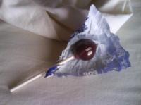 On a bed unmade/is a grape tootsiepop laid!