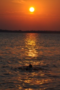 Oohm float sunset, July, Lake Winneconne, Wisconsin