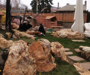 Man seeking solace in the Gilgal Sculpture Garden, Salt Lake City