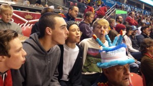 Guys at RSL game "blowing out" my birthday candle hat.