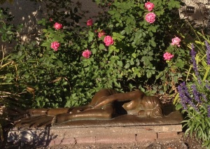 Nude laying in a rose garden-- Springville Museum of Art