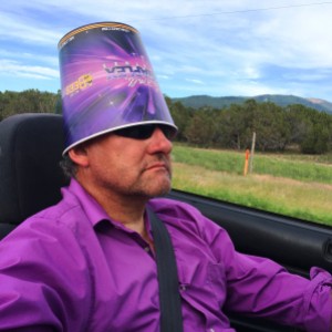 Topless Drivin' and Stylin' in a purple shirt with a purple popcorn  bucket