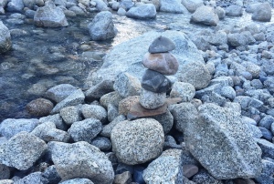 stacked rocks by a stream memory