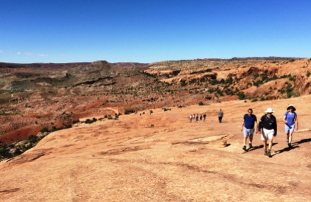 Slick Rock hikers heading to Delicate Arch with no water.
